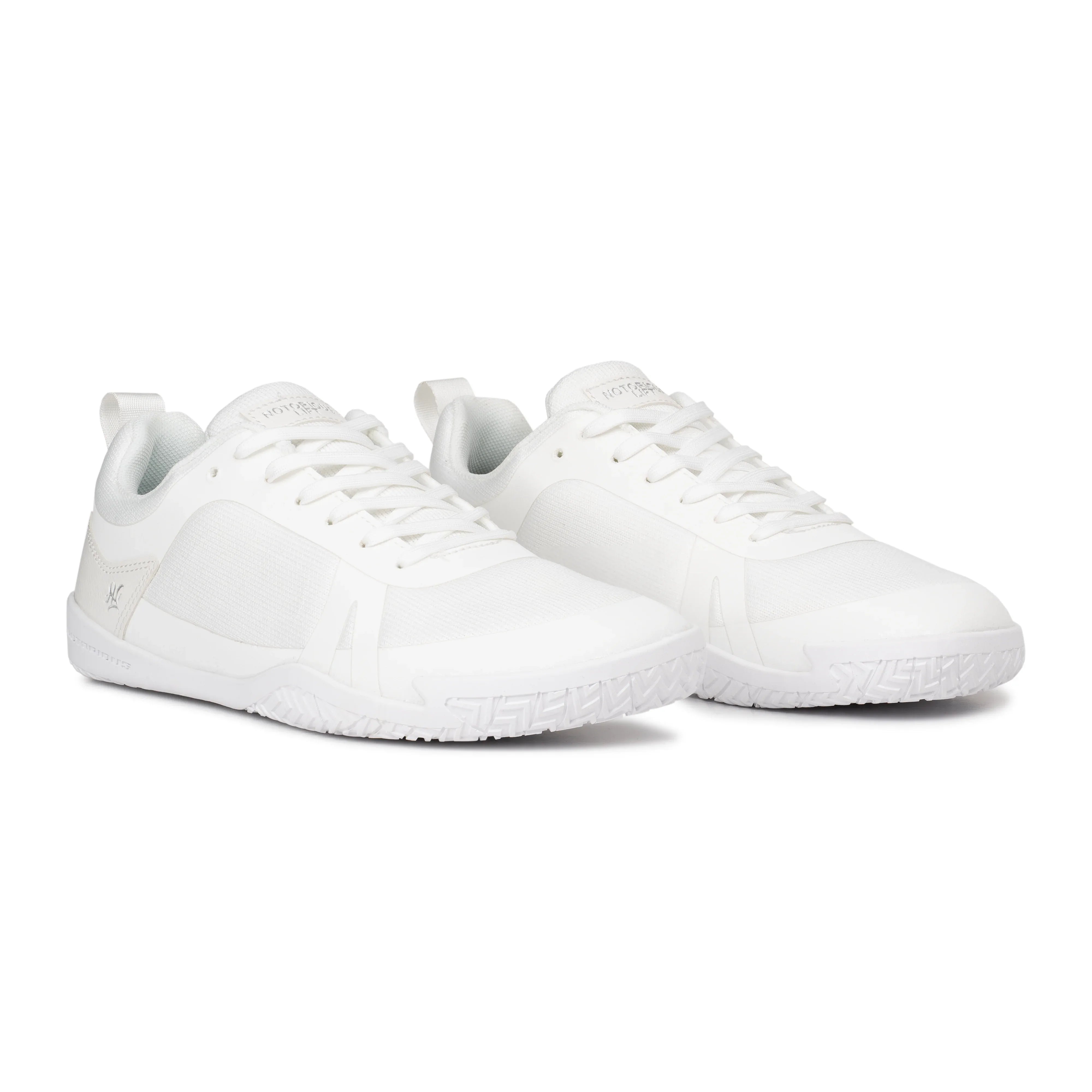 Radix Pure White barefoot training shoe angled view - flexible rubber outsole, mesh upper